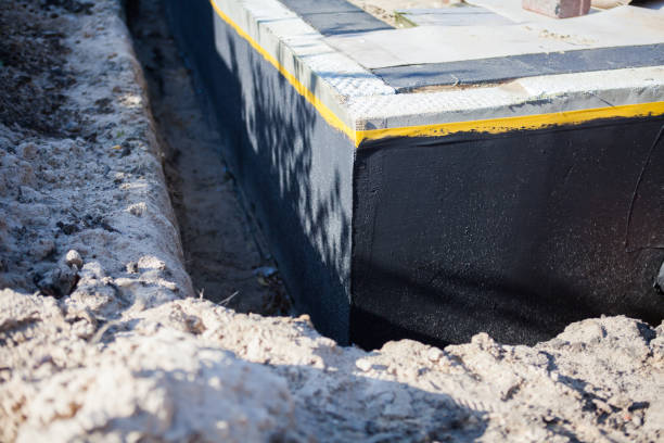 Professional Waterproofing technician working in Wellington, AL
